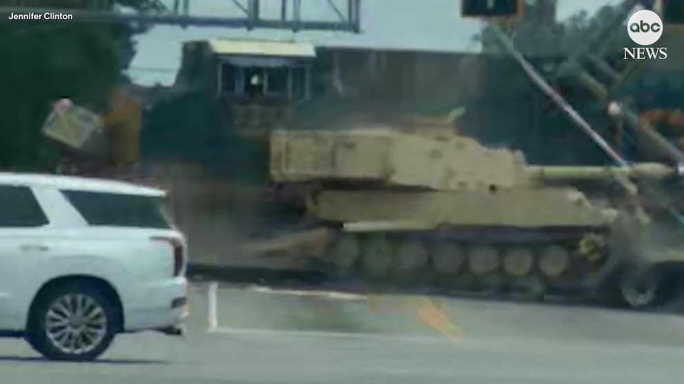 Train collides with military vehicle-carrying 18-wheeler in South Carolina on video