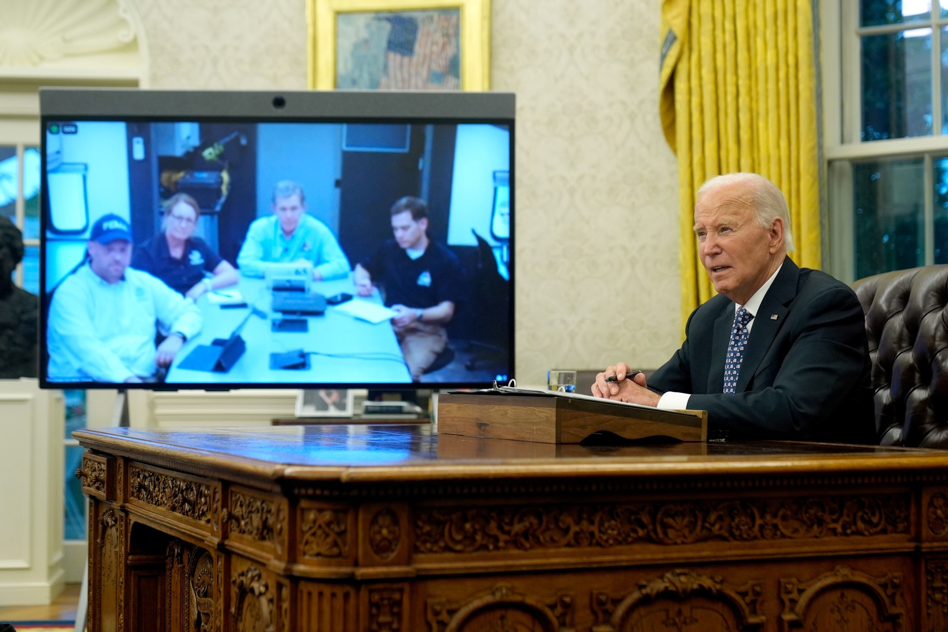 PHOTO: President Joe Biden speaks about the Biden administration's efforts to aid in recovery from the aftermath of Hurricane Helene from the Oval Office of the White House, Sept. 30, 2024. 