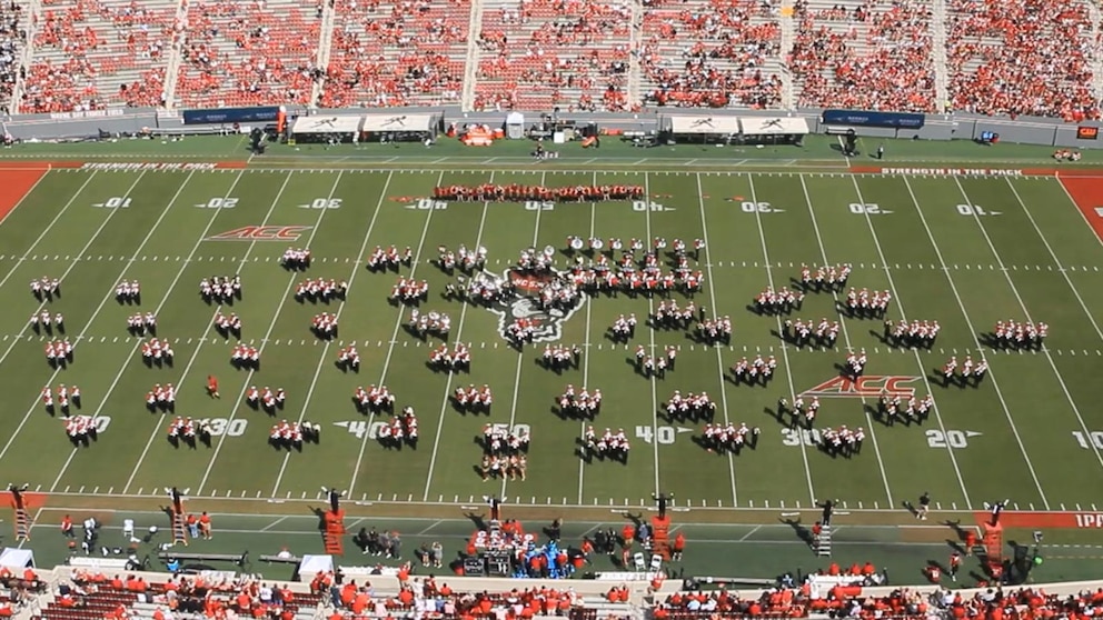 Two rival marching bands unite to pay tribute to victims of Hurricane Helene